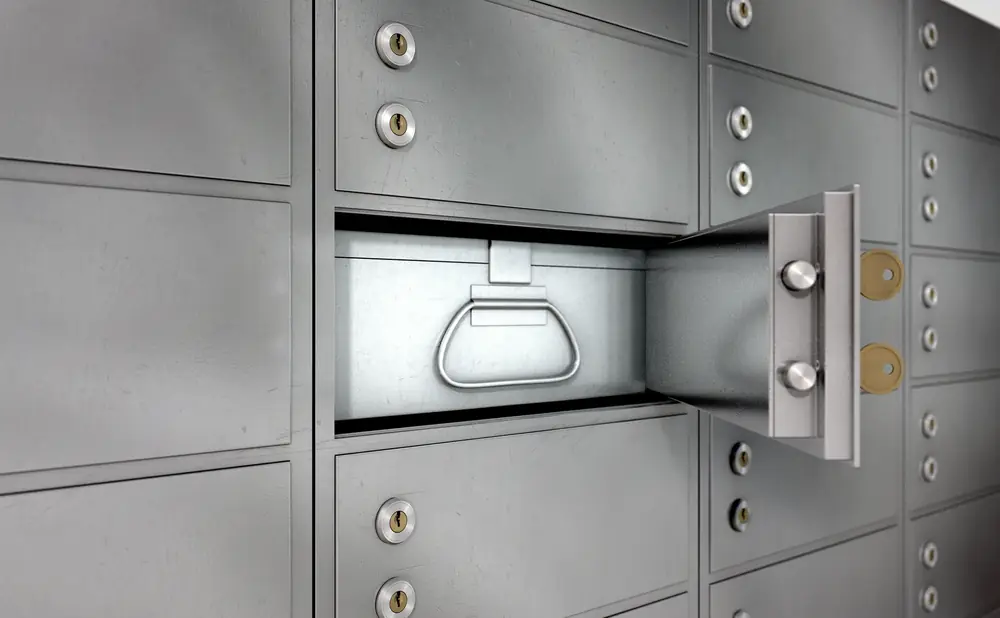 Wall of safe deposit boxes in a bank vault