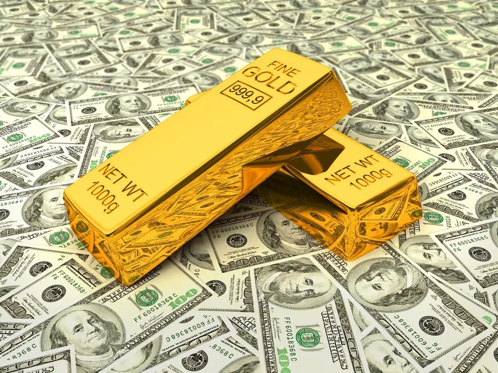 Gold bar on US dollar bills
