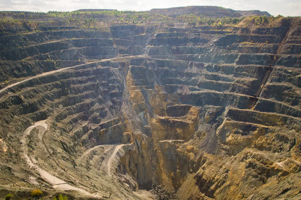 Open-pit gold mine with terraced walls