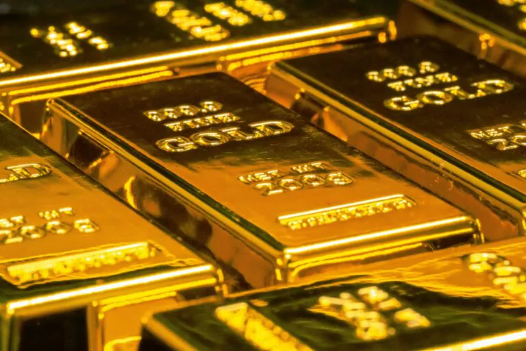 Gold bars stacked - gold bars vs gold coins investment comparison